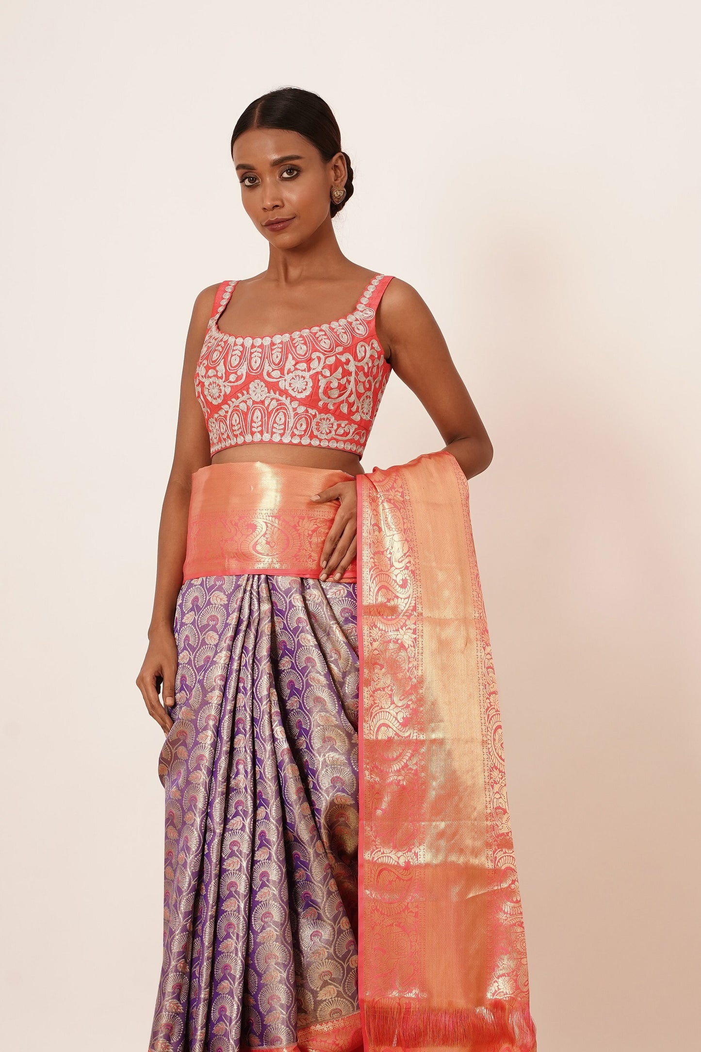 Violet Dharamavaram Silk Saree with thick intricate Peach Border and a Peach Blouse with all over Silver Zari Embroider