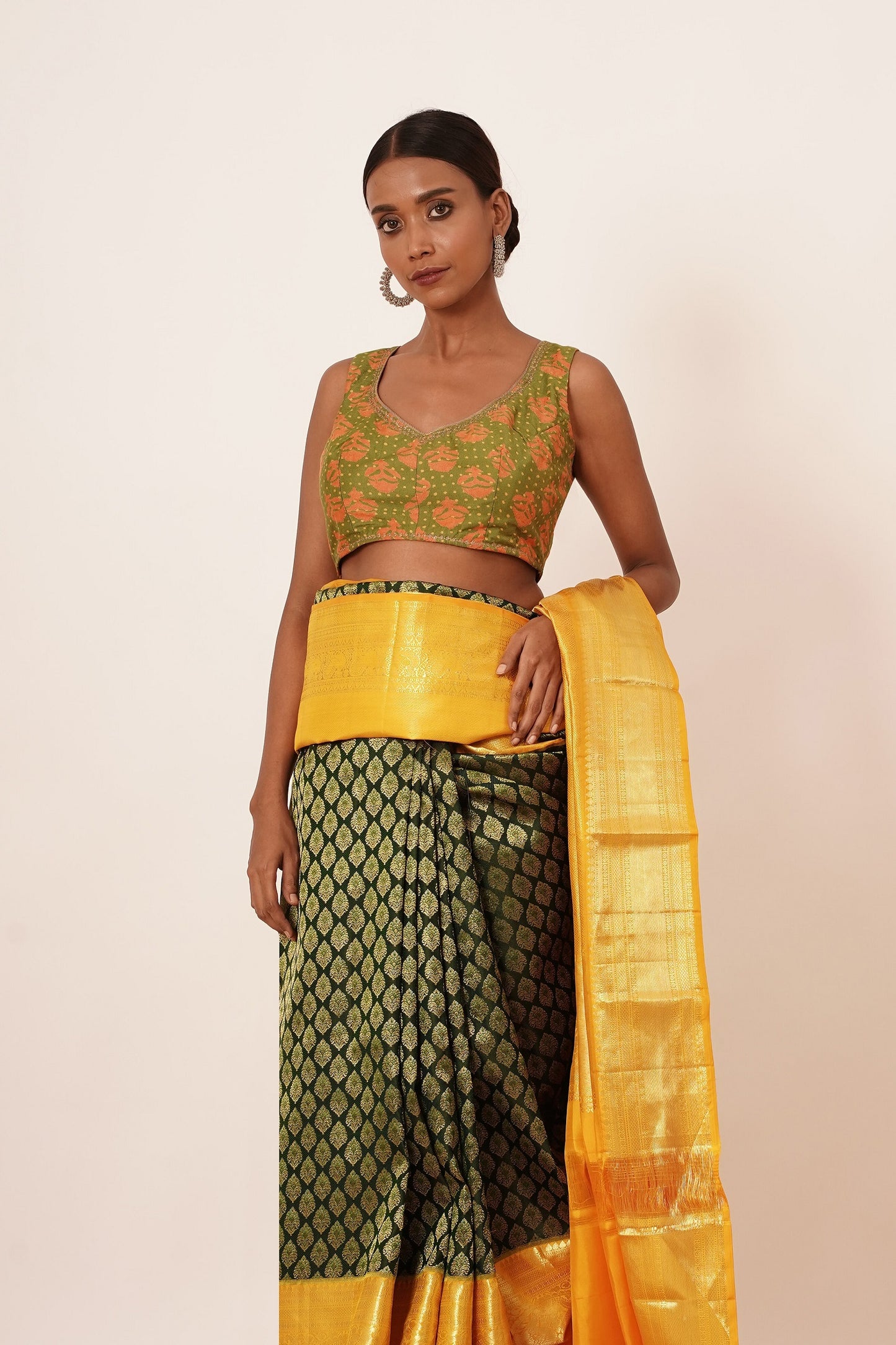 Dark Green Dharamavarm Silk Saree with Thick Yellow Intricate Border.