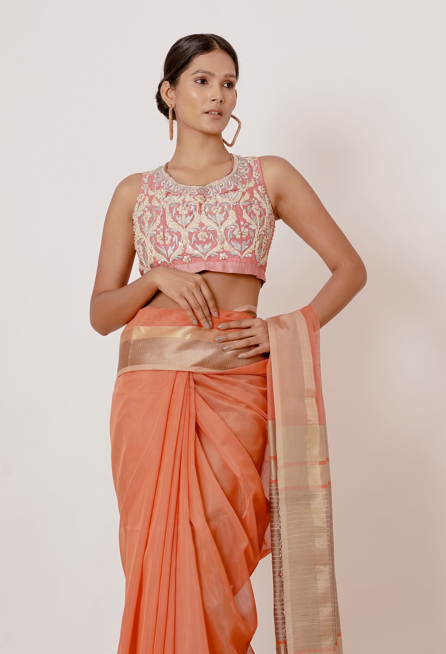 Coral Coloured Maheshwari Silk Saree with a Peach Blouse