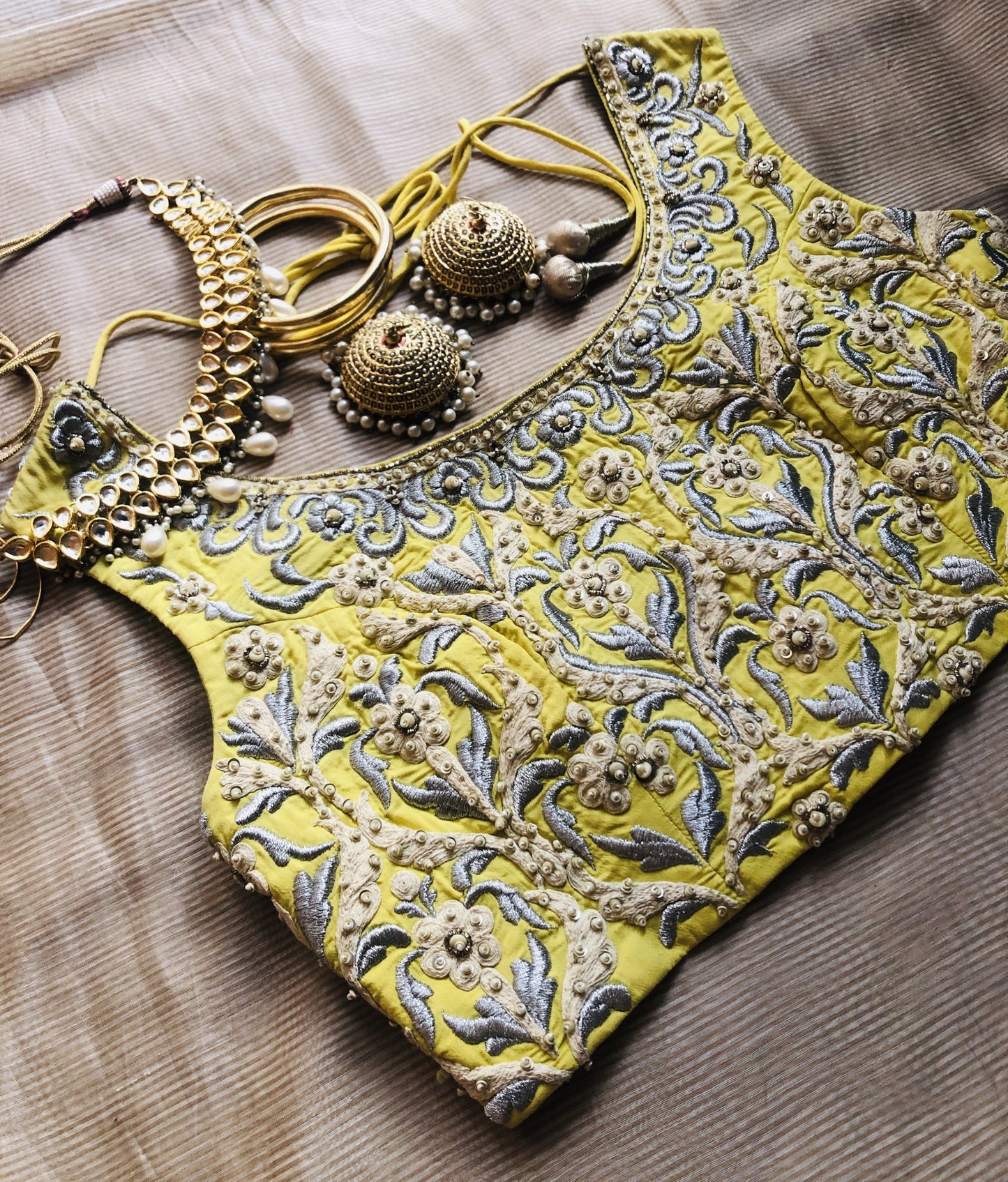 A Yellow fully embroidered blouse with pearl