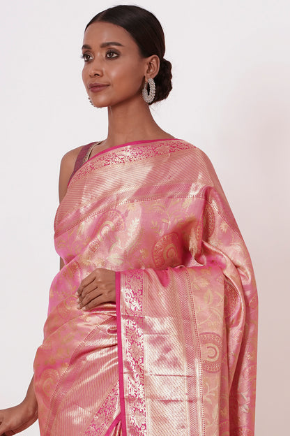Violet Dharamavaram Silk Saree with thick intricate Peach Border and a Peach Blouse with all over Silver Zari Embroider