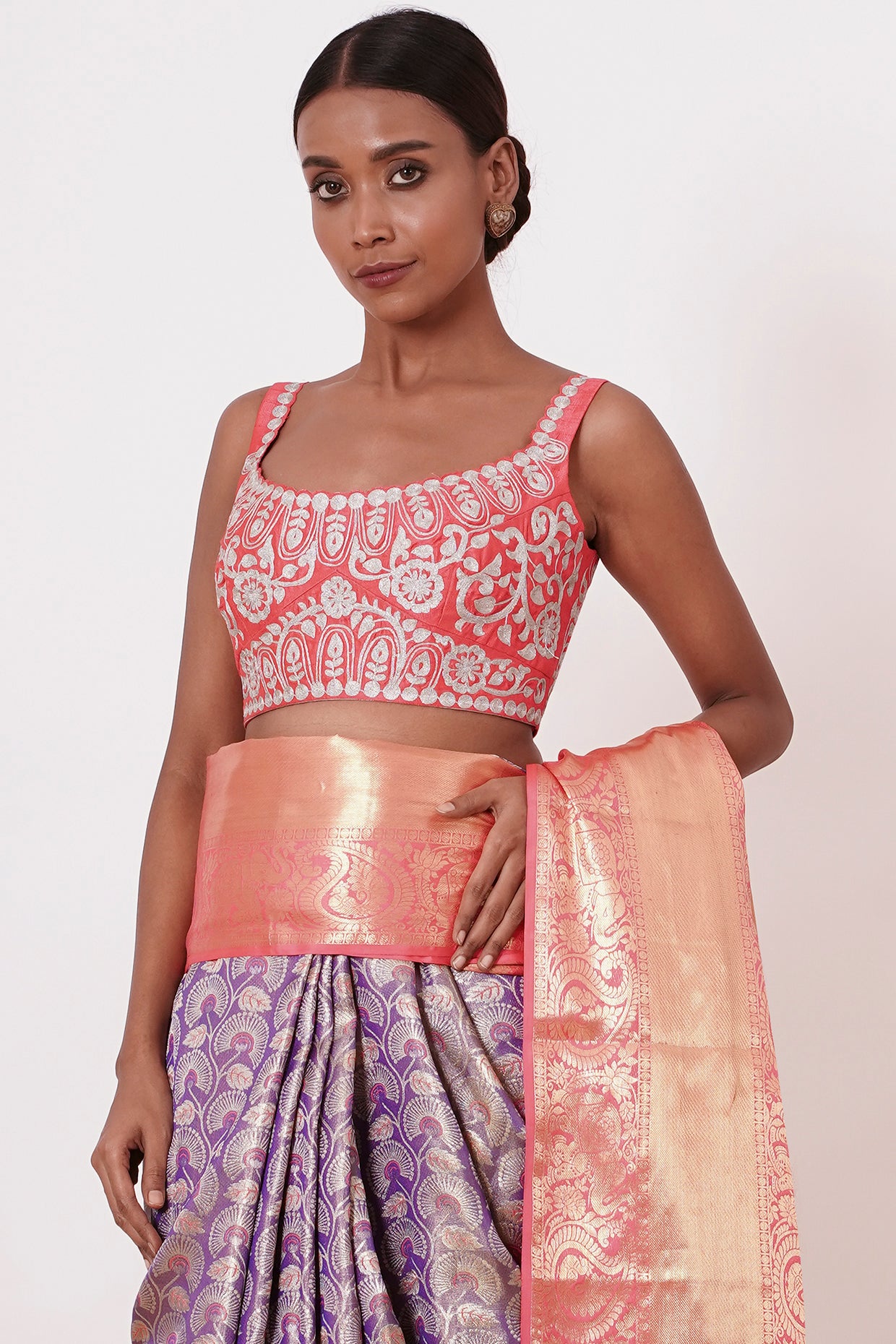 Violet Dharamavaram Silk Saree with thick intricate Peach Border and a Peach Blouse with all over Silver Zari Embroider