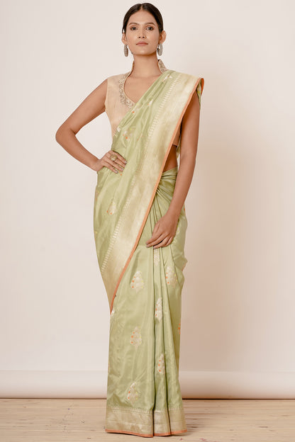 Dusty Pista Banarasi Silk Saree with Paisely Motifs and Gold Backless Blouse