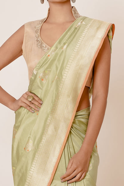 Dusty Pista Banarasi Silk Saree with Paisely Motifs and Gold Backless Blouse