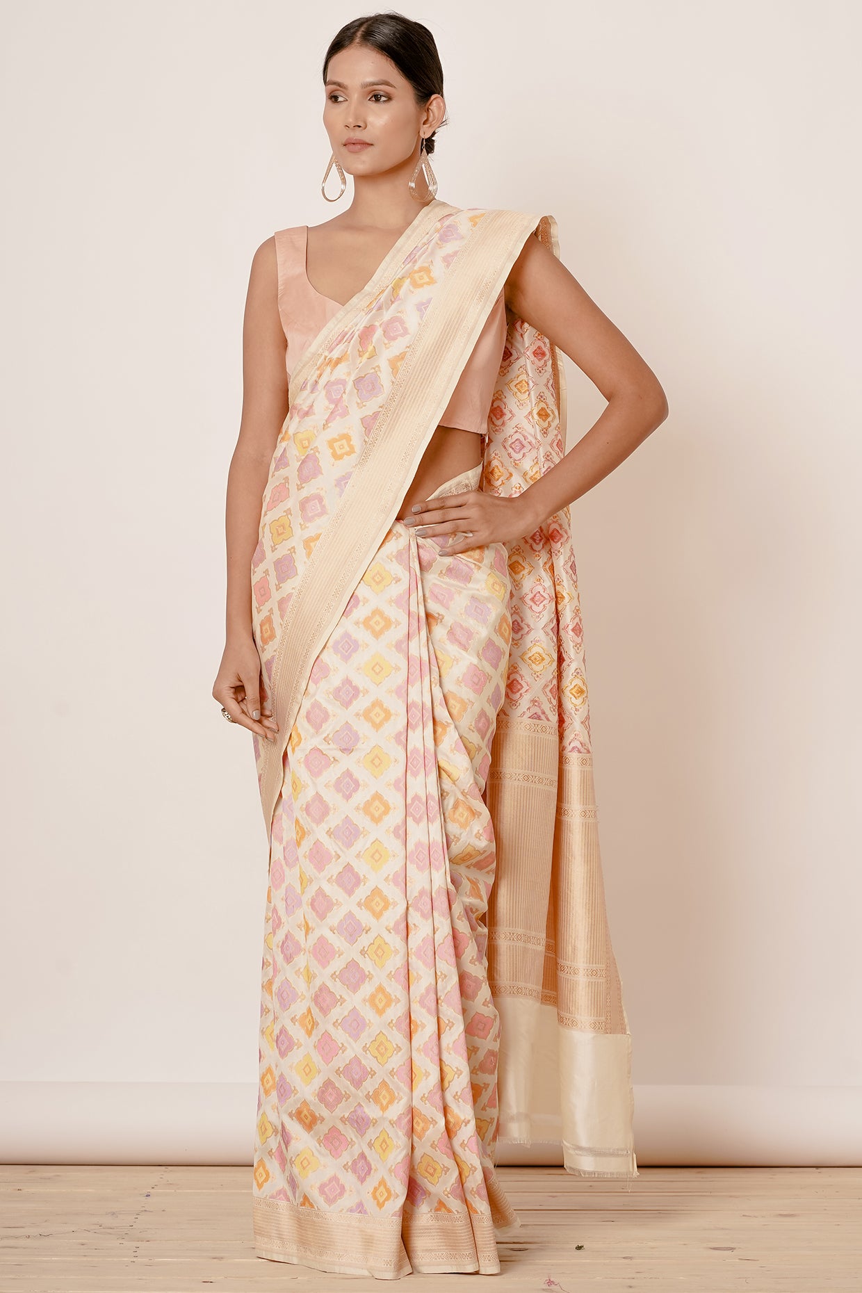 Ivory Banarasi Saree with Peach Blouse