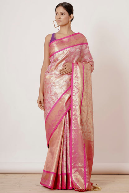 Onion Pink Dharmavaram Silk Saree with a Purple Backless Blouse