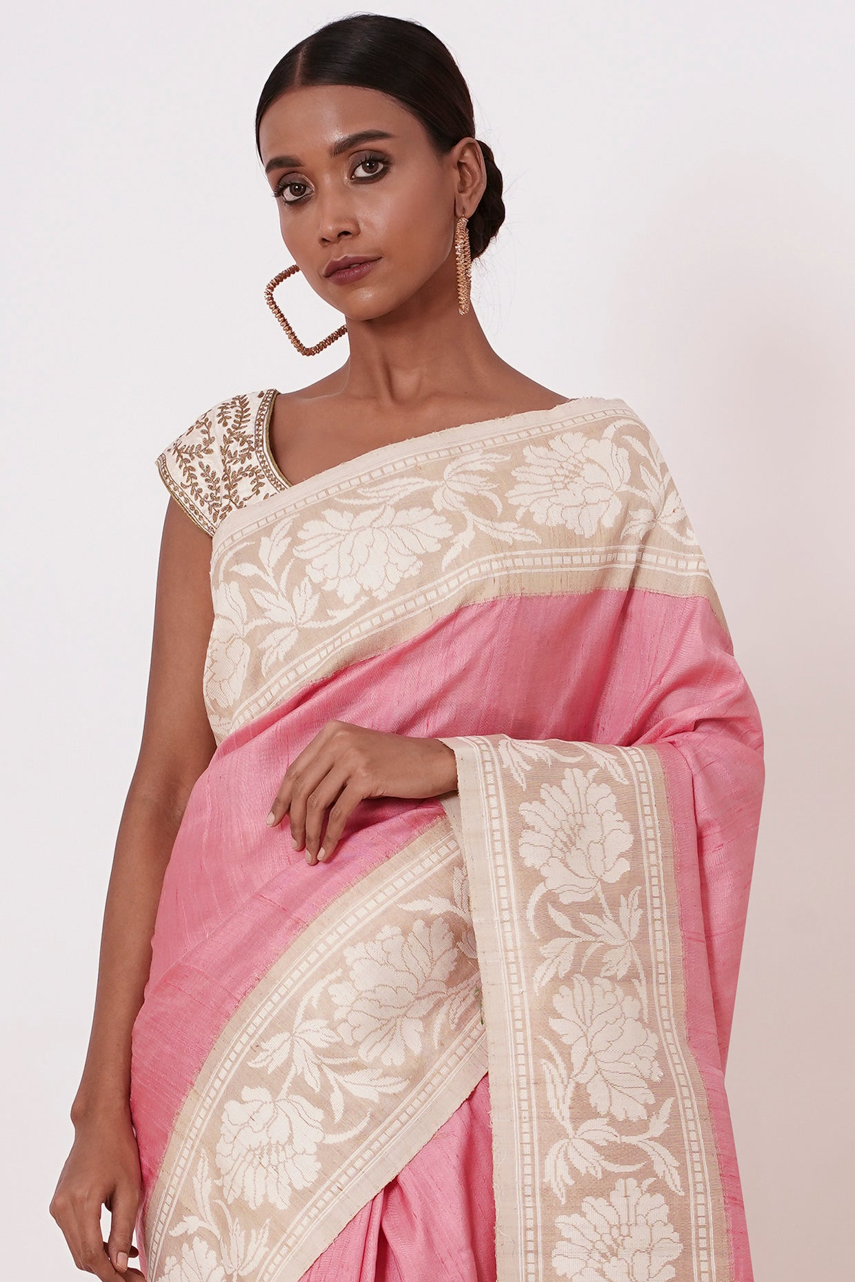 Onion Pink Banarasi Saree with a Cream Blouse
