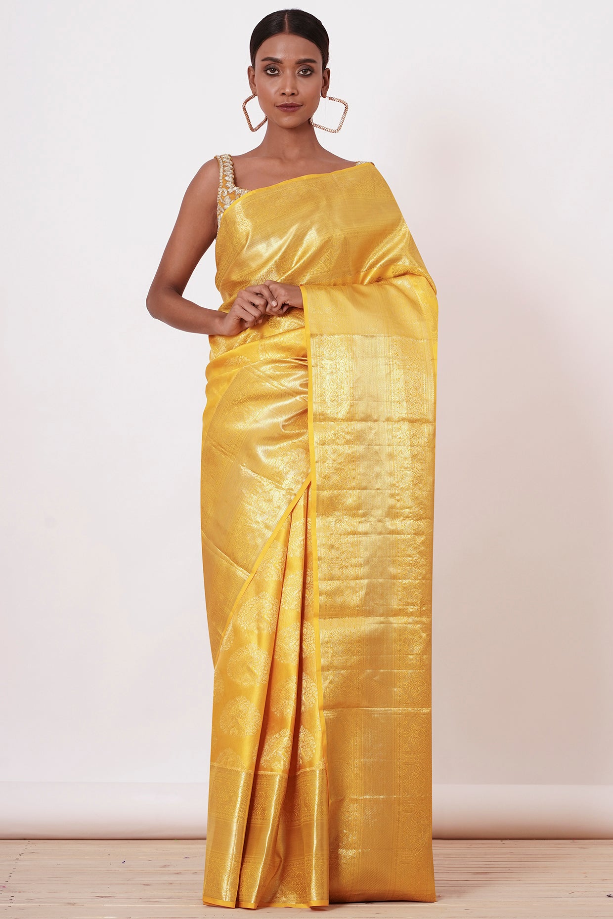 Royal Yellow Dharamavaram Silk Saree with a Gold Blouse .