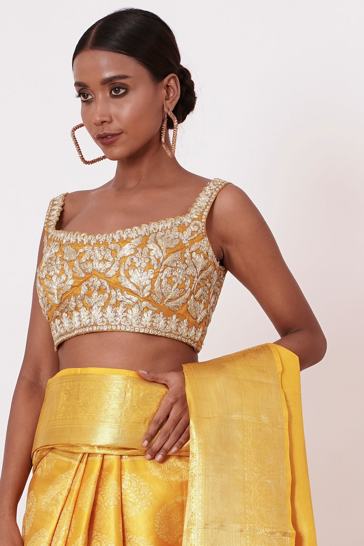 Royal Yellow Dharamavaram Silk Saree with a Gold Blouse .