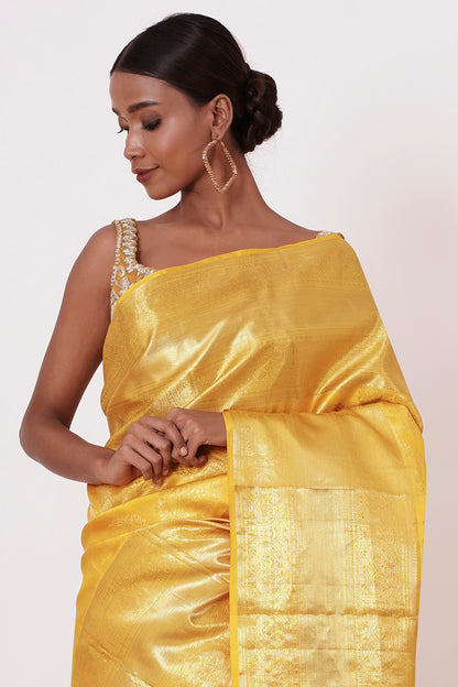 Royal Yellow Dharamavaram Silk Saree with a Gold Blouse .