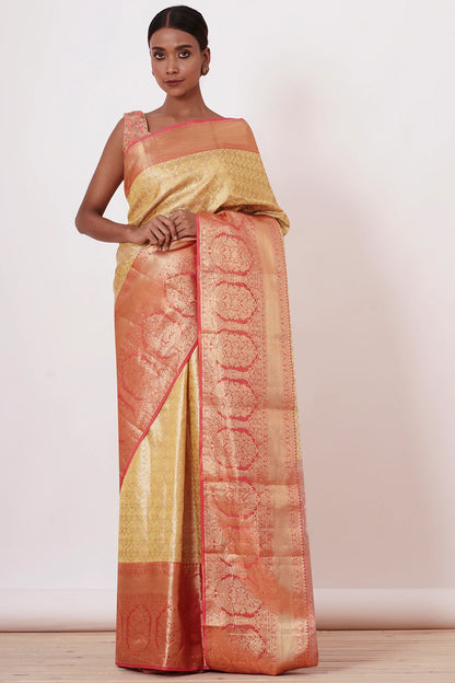 Gold Dharamavaram Silk Saree with a Peach Blouse