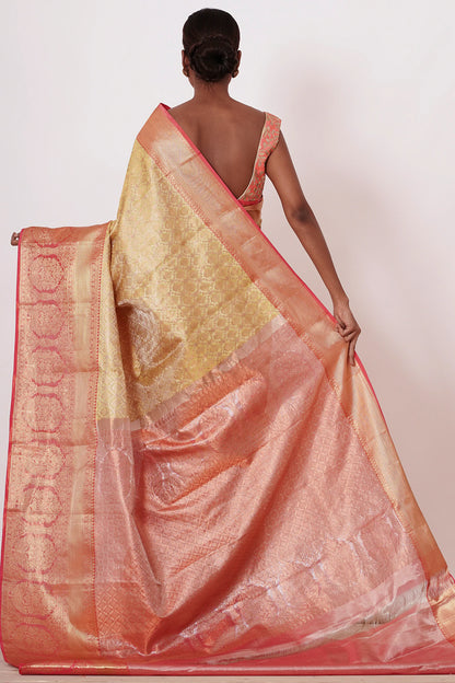 Gold Dharamavaram Silk Saree with a Peach Blouse