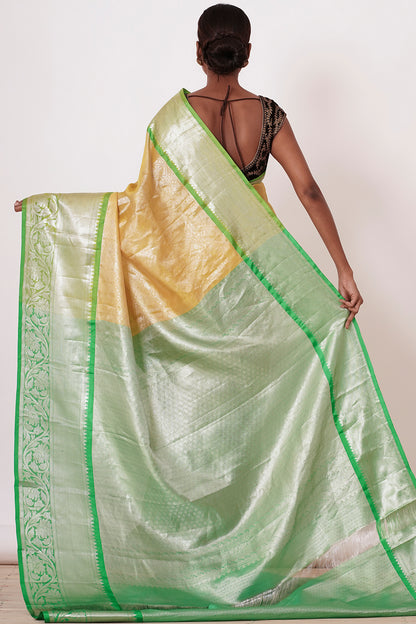 Pastel Yellow Saree with Green Border with Embroidered Velvet Blouse