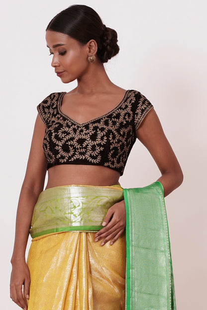 Pastel Yellow Saree with Green Border with Embroidered Velvet Blouse
