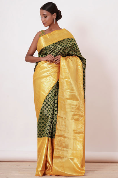 Dark Green Dharamavarm Silk Saree with Thick Yellow Intricate Border.