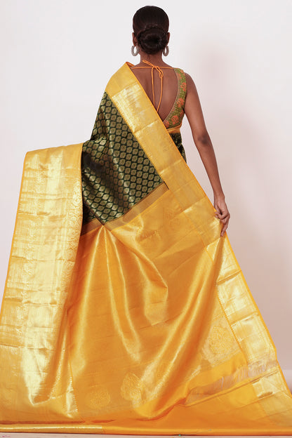 Dark Green Dharamavarm Silk Saree with Thick Yellow Intricate Border.