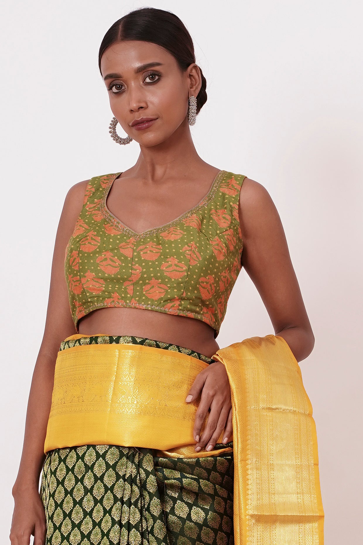Dark Green Dharamavarm Silk Saree with Thick Yellow Intricate Border.