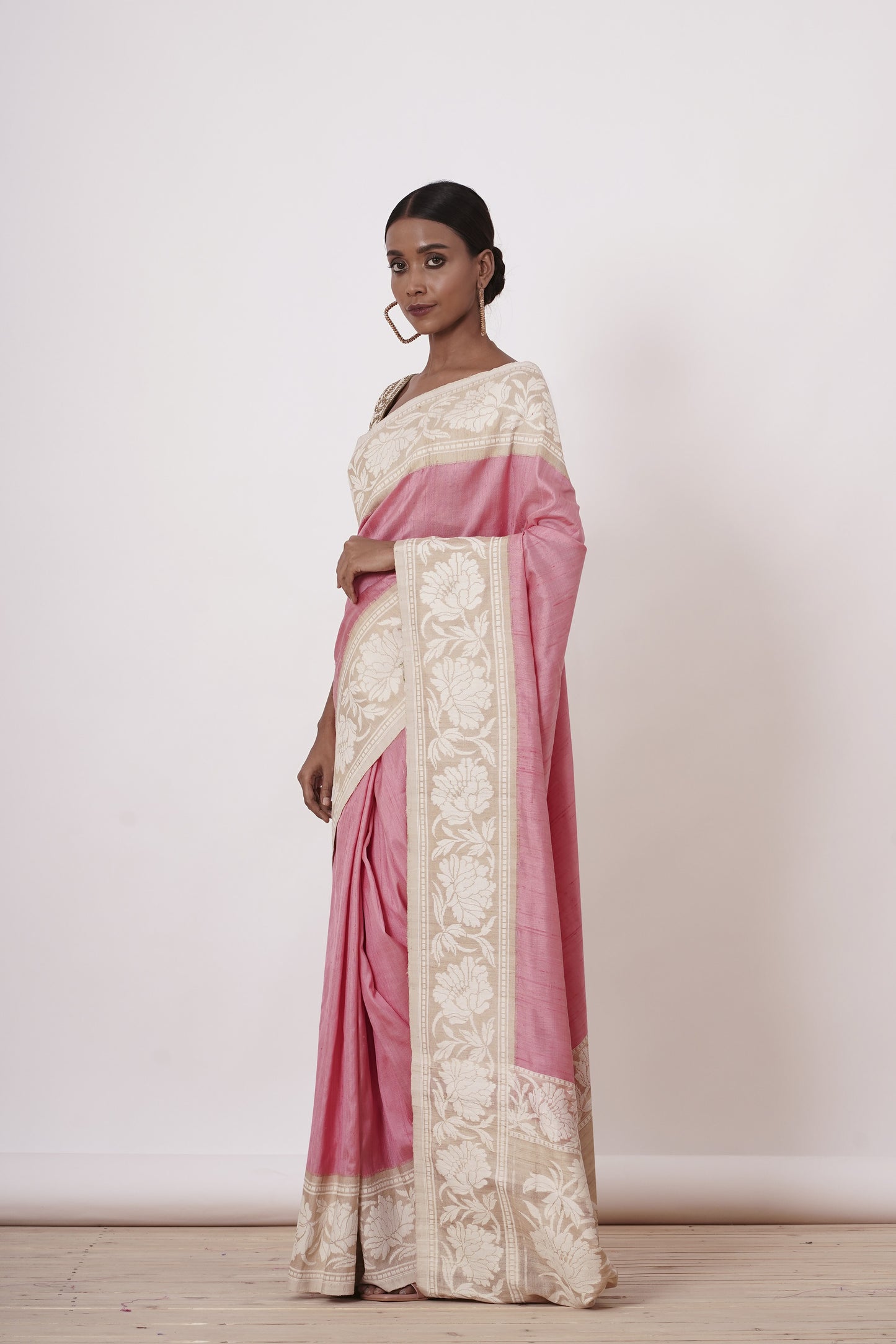 Onion Pink Banarasi Saree with a Cream Blouse