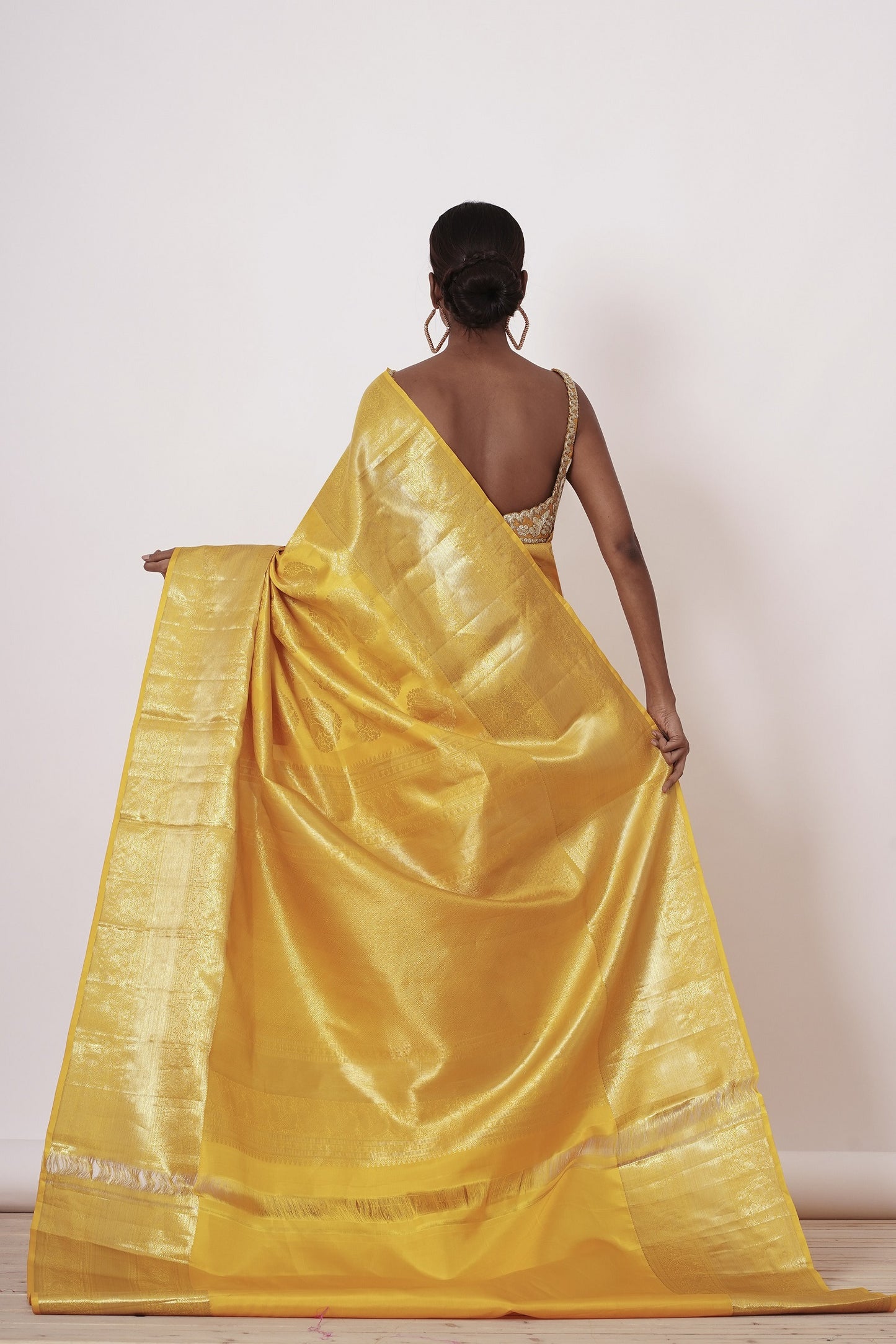 Royal Yellow Dharamavaram Silk Saree with a Gold Blouse .