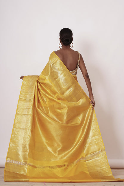 Royal Yellow Dharamavaram Silk Saree with a Gold Blouse .