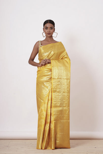 Royal Yellow Dharamavaram Silk Saree with a Gold Blouse .