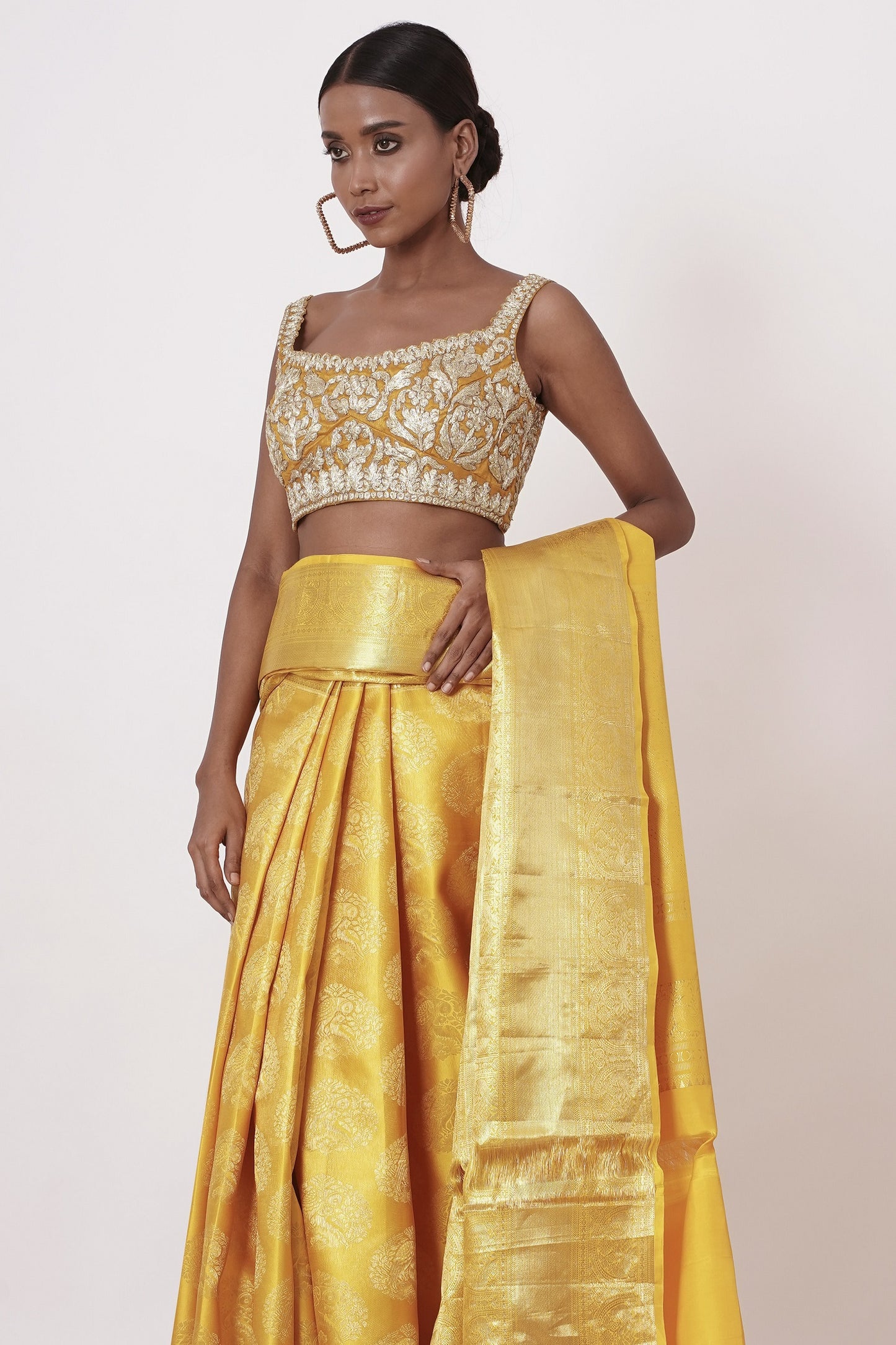 Royal Yellow Dharamavaram Silk Saree with a Gold Blouse .