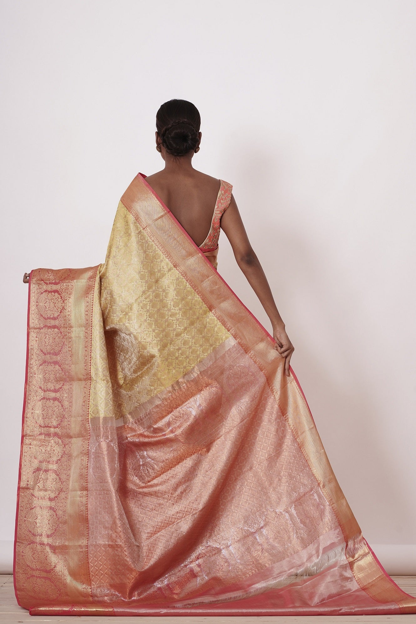 Gold Dharamavaram Silk Saree with a Peach Blouse