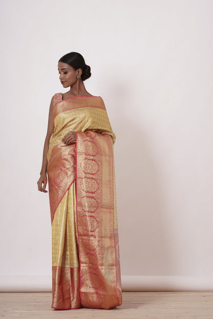 Gold Dharamavaram Silk Saree with a Peach Blouse