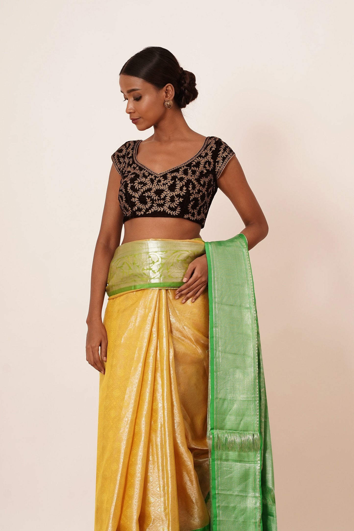 Pastel Yellow Saree with Green Border with Embroidered Velvet Blouse