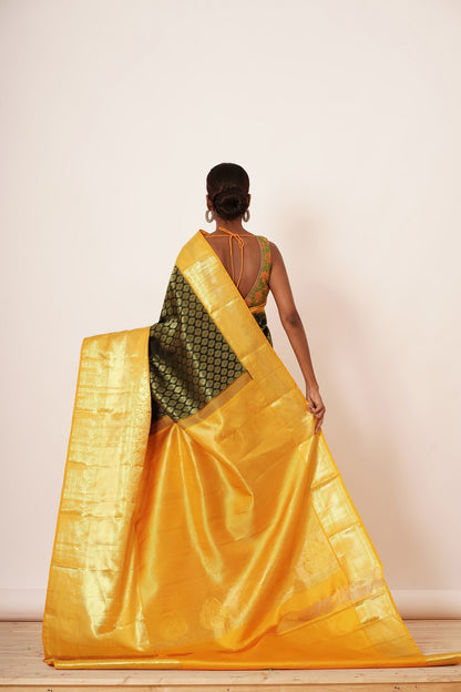 Dark Green Dharamavarm Silk Saree with Thick Yellow Intricate Border.