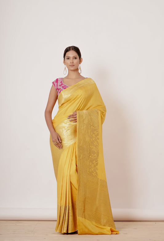 Bright yellow banrasi silk saree with pink blouse