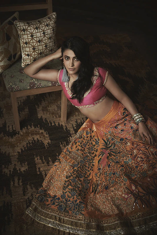 Shruti Hassan in Pink & Mustard Yellow Floral Temple Embroidered Heavy Lehenga Set