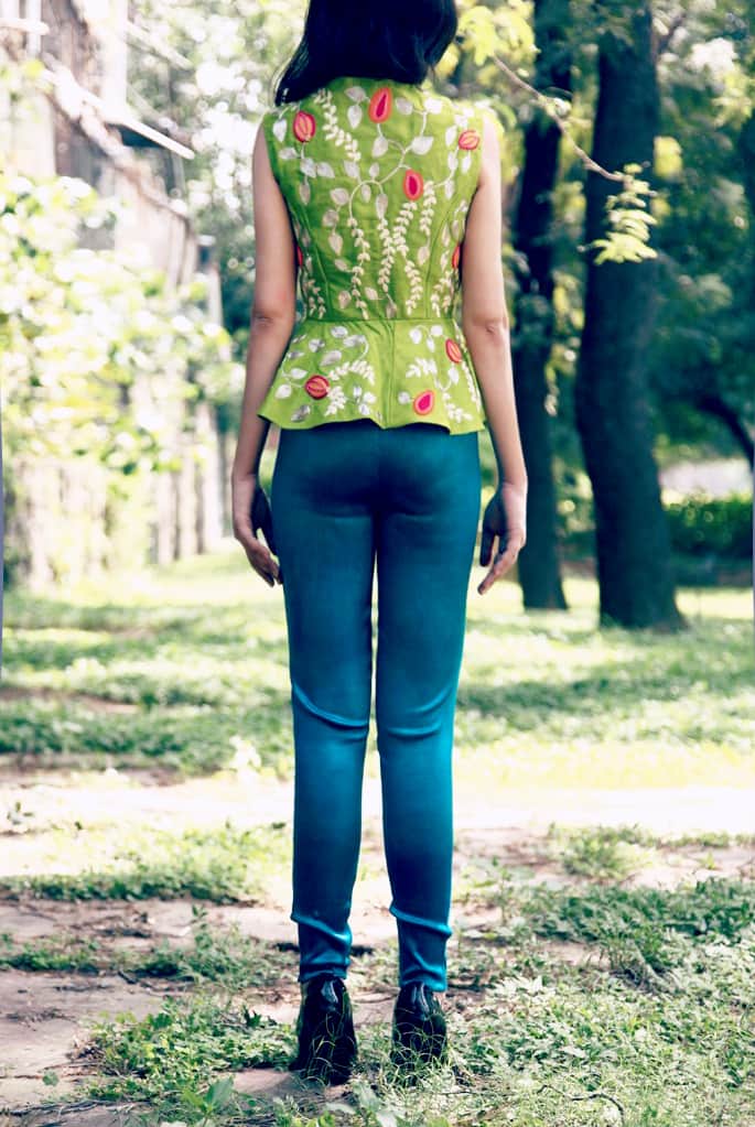 Lime green bird peplum jacket with teal fitted cigarette pants