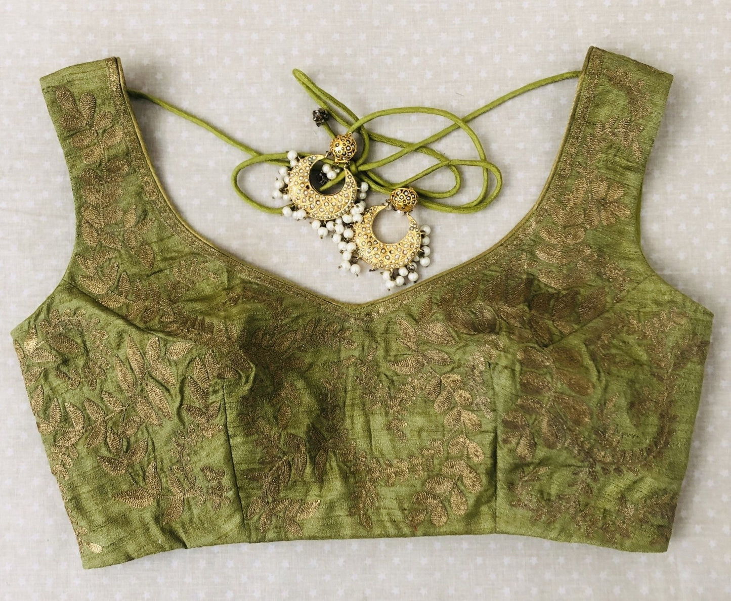 olive green silk blouse with golden motifs