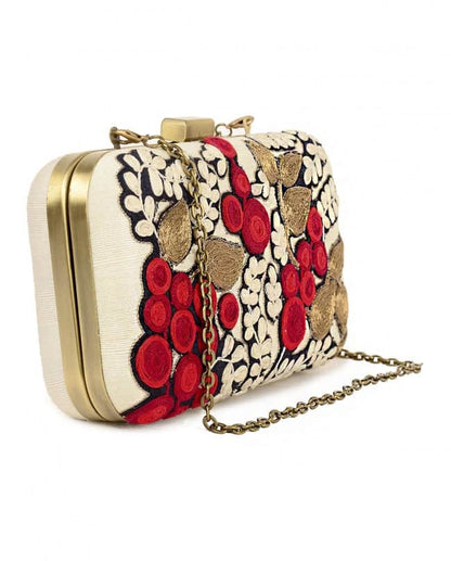 Ivory clutch with red fruit and leaf embroidery